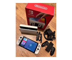 Console Nintendo Switch OLED 64Go blanche + 7 jeux eShop + carte microSD 128Go